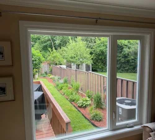 Interior living room view of a large replacement picture window in Mississauga