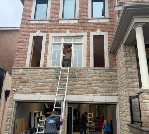 Black Triple-Glass Window and Door Replacement in Vaughan, Ontario - northshield project 11 front townhome installation ladder