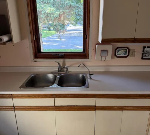 Full-Frame Wood Window Replacement Project in Winnipeg, Manitoba - northshield project 17 before kitchen window wood trim