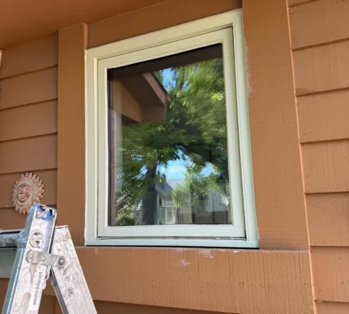 Full-Frame Wood Window Replacement Project in Winnipeg, Manitoba - northshield project 17 brown siding window with ladder