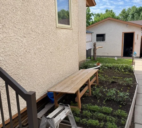 Full-Frame Wood Window Replacement Project in Winnipeg, Manitoba - northshield project 17 side stucco wall window exterior