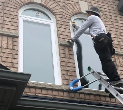 Triple-Glass Window Replacement Project in Brampton, Ontario - arched window installation ladder