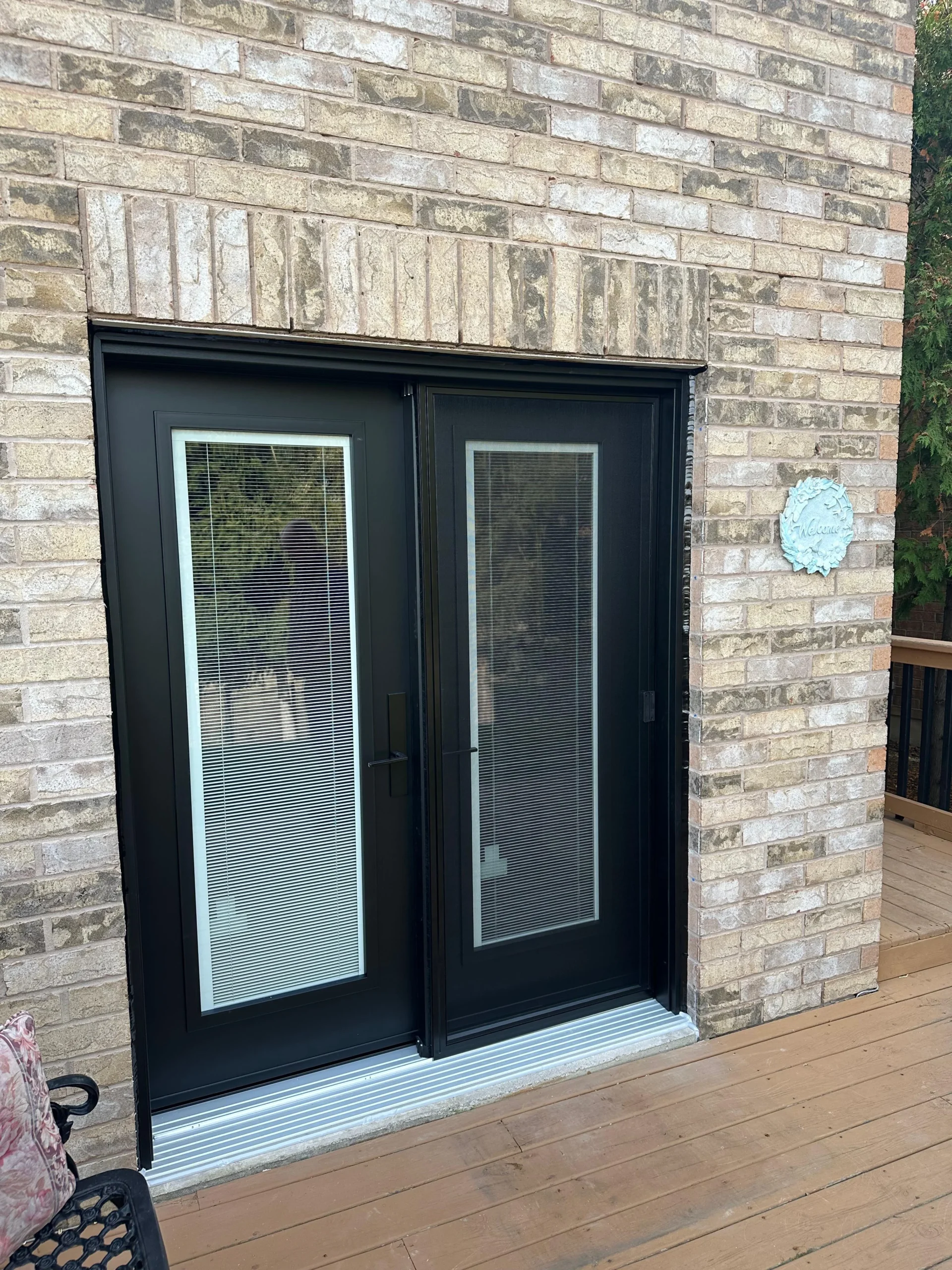Black double entry door project showing curb appeal and a secure entry design.