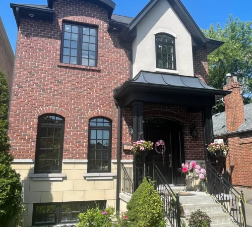 Custom Full-House Window Replacement Project in Etobicoke, Ontario - brick home black window exterior