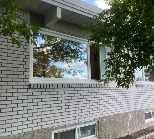 Full-Frame Triple-Glass Window Replacement Project in Calgary, Alberta - brick home window exterior calgary