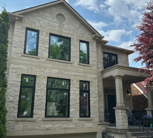 Black Exterior Triple-Glass Window Replacement Project in Toronto, Ontario - front home window replacement