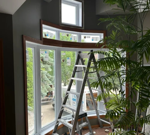 Triple-Glass Full-House Window Replacement Project in Winnipeg, Manitoba - interior window installation ladder