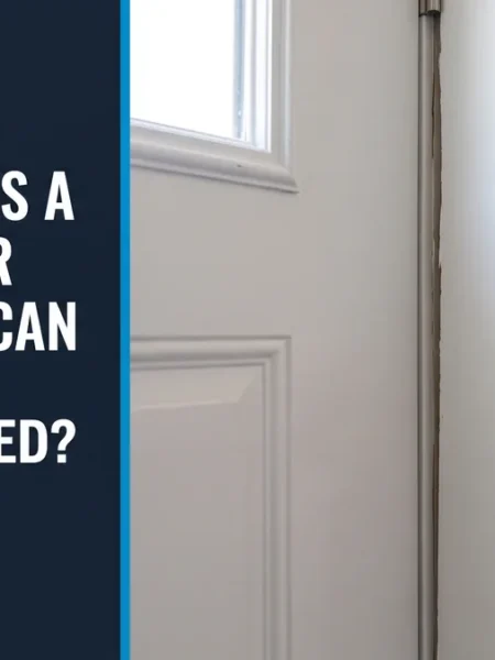 Level held against a white door jamb showing an uneven gap, illustrating a bowed door frame