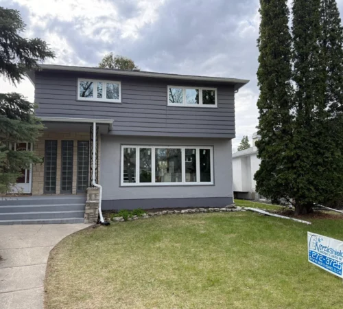 Retrofit Window Replacement Project in Winnipeg, Manitoba - northshield project 04 two storey home window project exterior