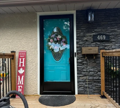 Full-Frame Window and Door Replacement Project in Winnipeg, Manitoba - northshield project 18 blue front entry door exterior