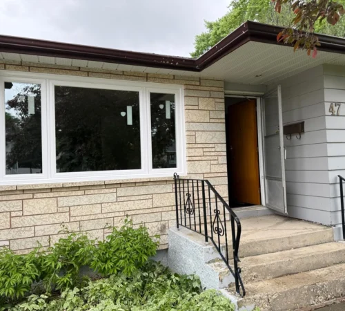 Full-Frame Living Room Window Replacement Project in Winnipeg, Manitoba - northshield project 22 front house window and entry exterior