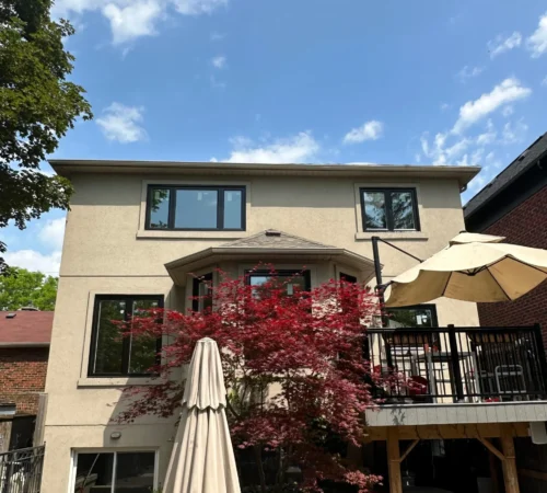 Black Exterior Triple-Glass Window Replacement Project in Toronto, Ontario - rear home window replacement