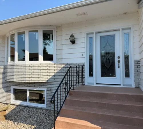 Winnipeg home with new triple glass windows and full glass entry door with sidelites