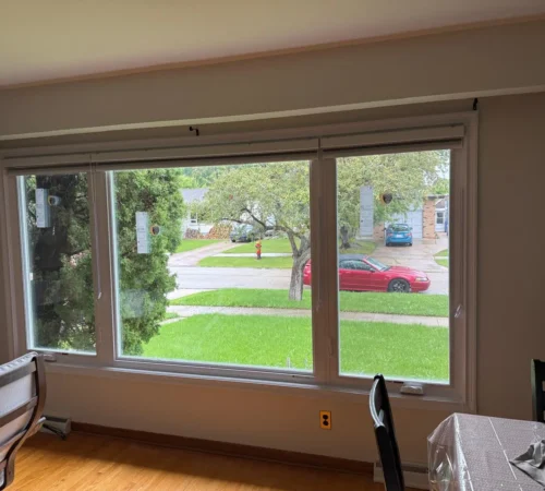 Wide triple glass living room window with vinyl interior finishing
