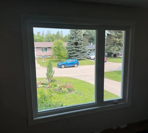 Interior view of offset casement and fixed replacement window in Calgary