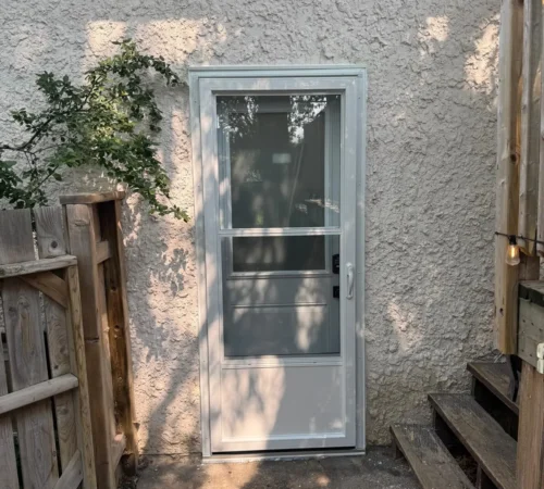 White storm door installed on Calgary home exterior