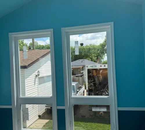 turquoise room double window interior.webp