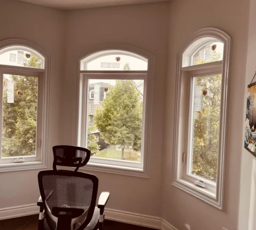 Arched transom and casement window combination from inside