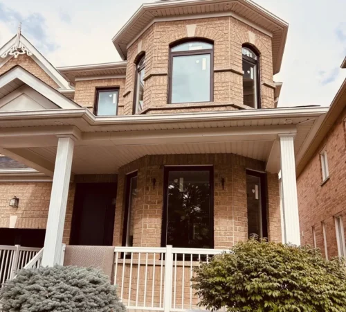 Markham brick home with brown replacement windows