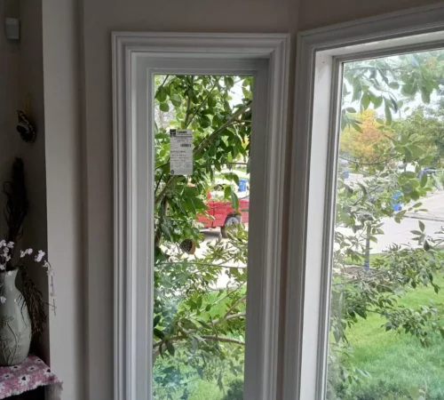 Tall casement window inside, finished to match the existing casing